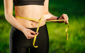 young-woman-measuring-her-thin-waist-with-tape-measure_8353-5995.png